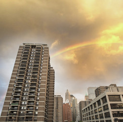 Rainbow over New York buildings in Manhattan