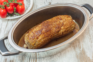 Freshly grilled meat roulade in a frying pan