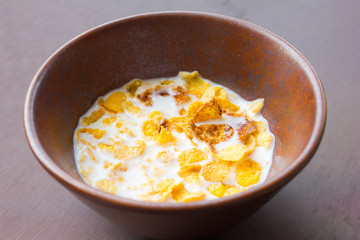 bowl with corn flakes on the table