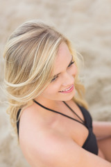 Naklejka premium Overhead Close up of a smiling relaxed blond at beach