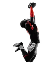 Fotobehang american football player catching ball  silhouette © snaptitude