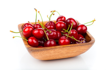 cherry berry in wooden bowl, isolated on white background