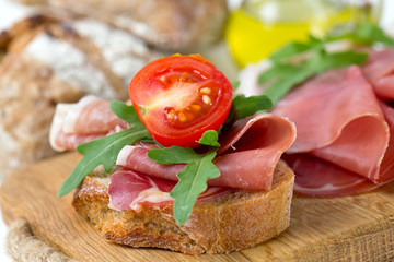 bread with sliced prosciutto crudo