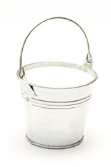 Metal pail, Bucket full of milk on a white background