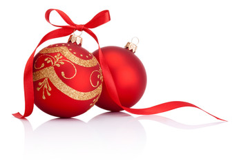 Two Red christmas decoration balls with ribbon bow isolated on w