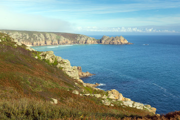 Fototapeta na wymiar Coast of Cornwall England in autumn with mist and blue sky