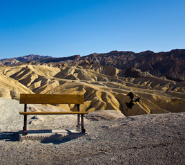Bench and raven at Zabriskie Point