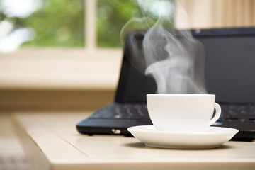 Laptop and a cup of coffee