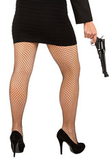 Legs of dangerous woman with handgun and black shoes