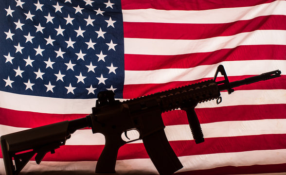 gun silhouette on american flag