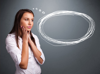 Young lady thinking about speech or thought bubble with copy spa