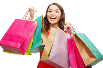 woman in red dress with colorful shopping bags