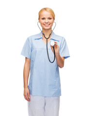 smiling female doctor or nurse with stethoscope