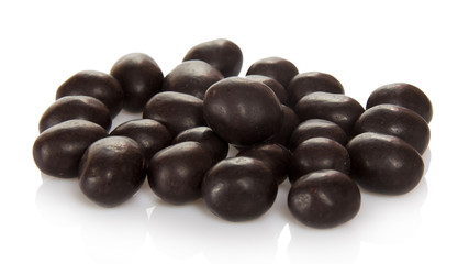 Sweet peanuts in chocolate isolated on white.
