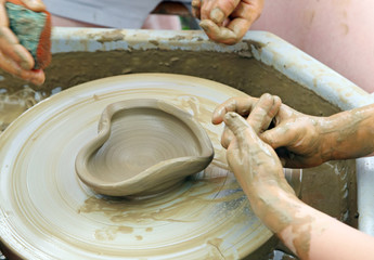 Potters team.Heart manufacturing.