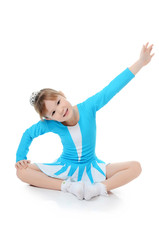Little girl the gymnast does exercise