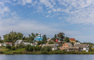 Fototapeta na wymiar Small Ukrainian village with a blue church