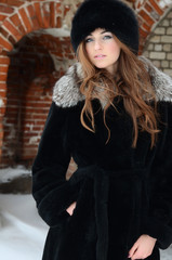 The beautiful woman brunette in winter