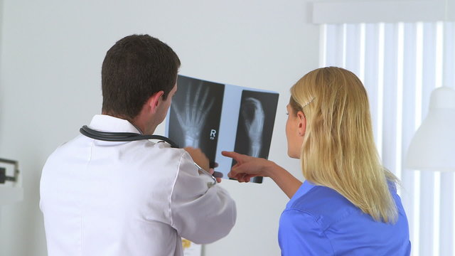 Doctor reviewing x-ray with patient