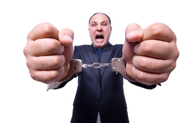 Businessman with handcuffs on white