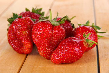 Many strawberries on wooden table