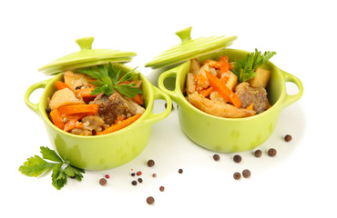 Homemade beef stir fry with vegetables in color pans, isolated