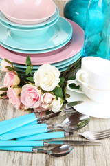 Lots beautiful dishes on wooden table close-up