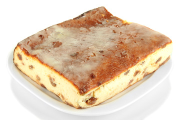 Cheese casserole with raisins on plate isolated on white