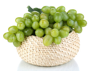 Ripe green grapes in basket isolated on white