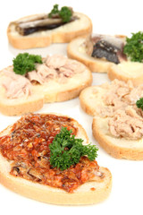 Tasty sandwiches with tuna and cod liver sardines different
