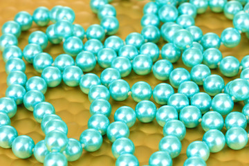 Color beads on bright background, close-up
