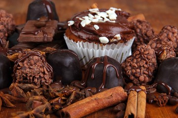 Tasty cupcake with different sweets close up