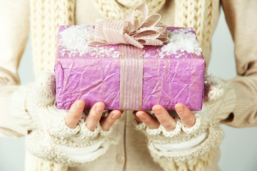 Female hands with gift box, close-up