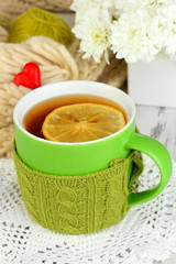 Cup with knitted thing on it close up