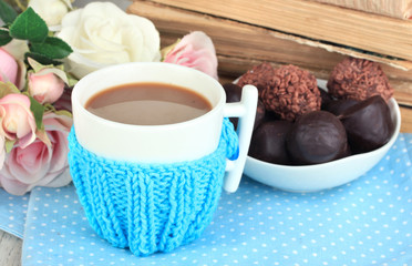 Cup with knitted thing on it close up
