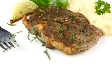 Grilled steak with potato salad and herbs