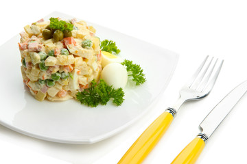 Russian traditional salad Olivier, isolated on white