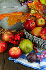 Juicy apples in basket on table close-up