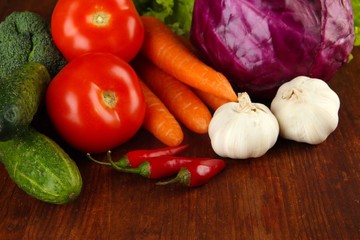 Composition of different vegetables on wooden background