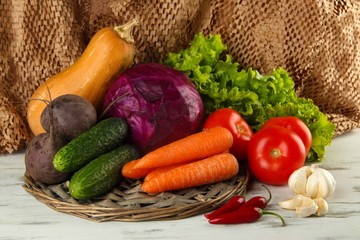 Composition of different vegetables on table on brown