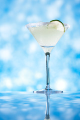 margarita  cocktail glitter blue background