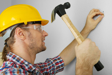 Portrait of young foreman in room