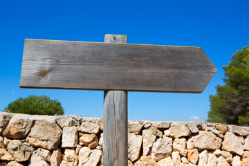 Wooden track blank road sign in Mediterranean Balearic