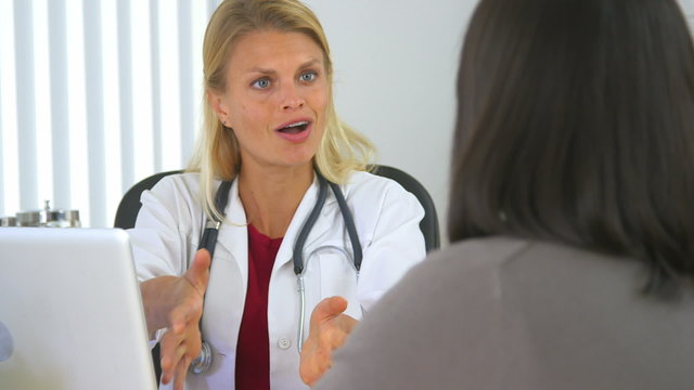 Doctor giving good news to Japanese patient