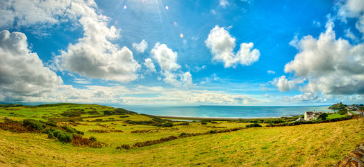 Seaside panorama of Wales England with sunny sky and clouds