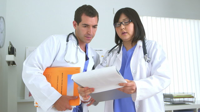 Two doctors reviewing test results