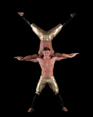 Pair of young muscular half-naked acrobats