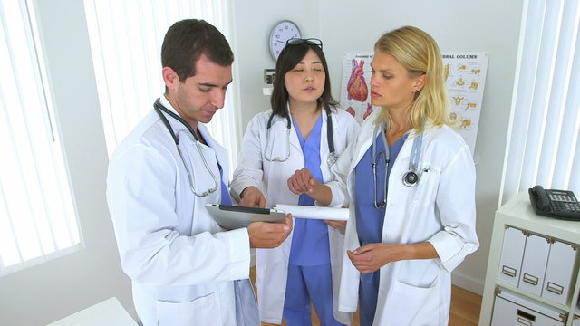 Team of doctors reviewing their notes