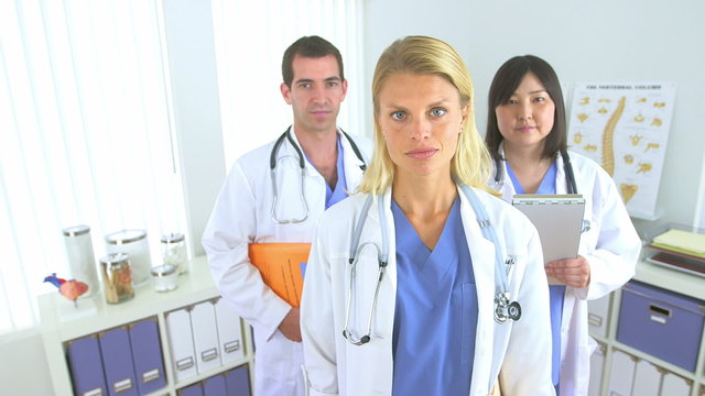 Team of highly skilled doctors standing in the office