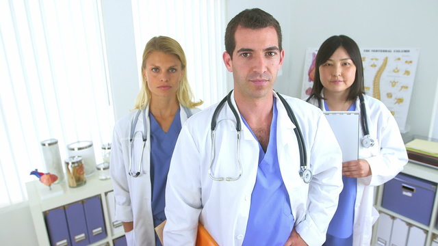 Team of highly skilled doctors standing in the office